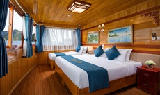 Giường trong phòng chung tại La Paci Cruises